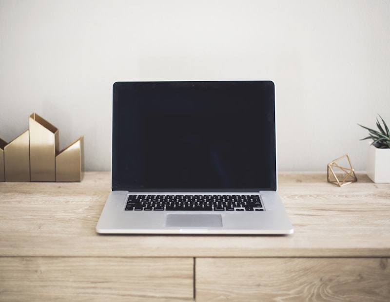 Laptop and gear on a travel desk